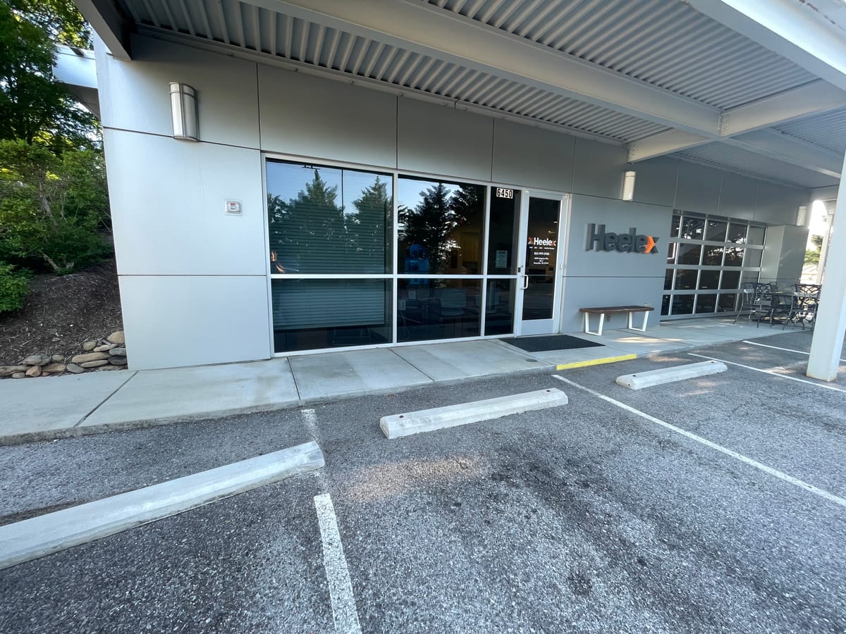 Exterior of the Heelex clinic in Knoxville, Tennessee, showing the entrance, walkway, and Heelex sign.