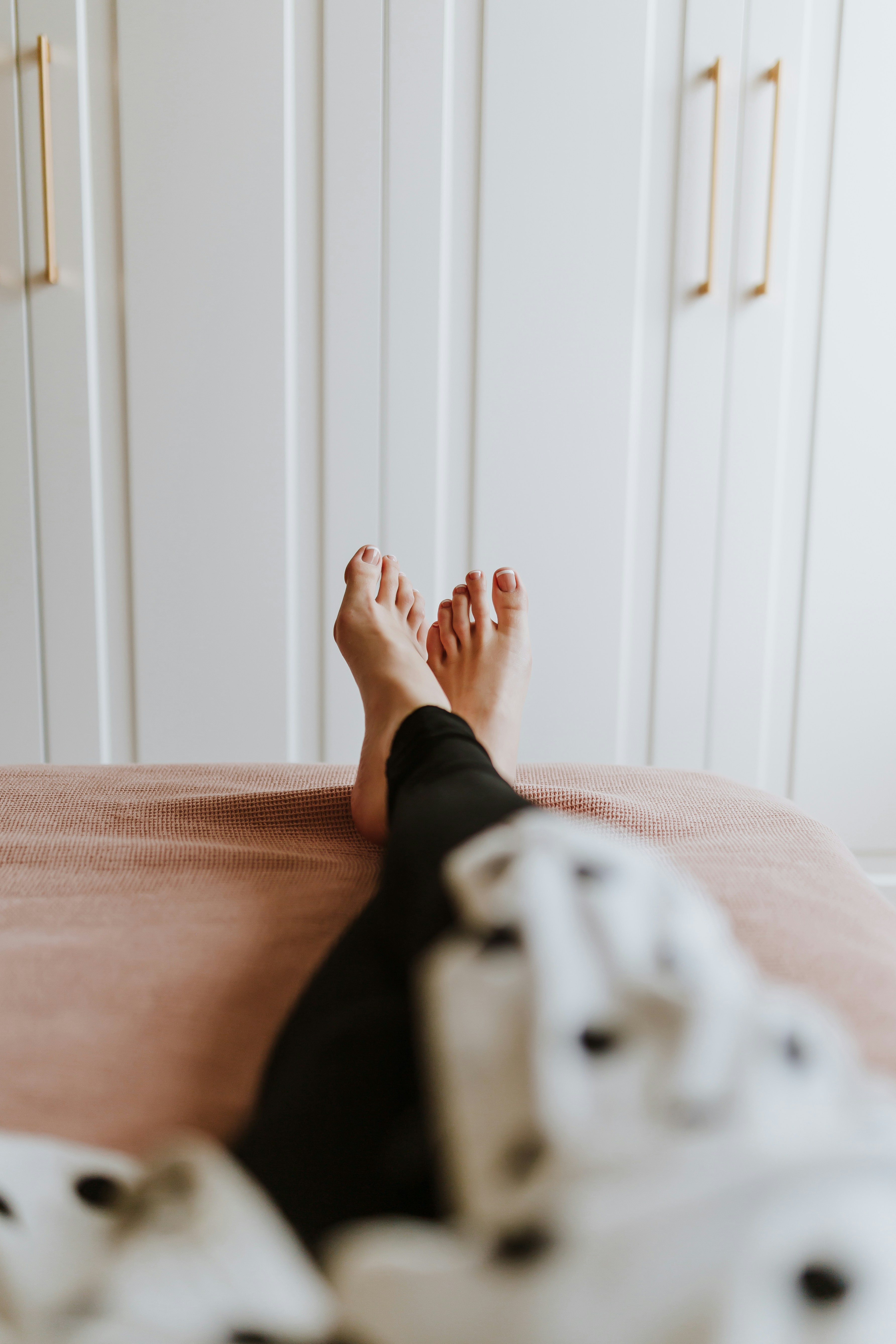 A bare foot at rest in soft morning light.